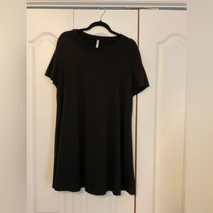 Little black t-shirt style dress with stretch fabric .